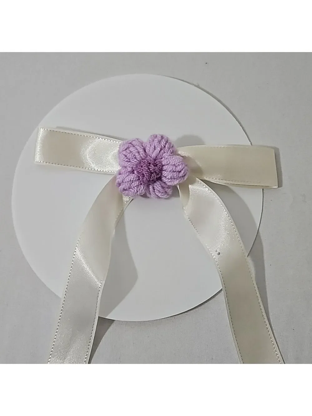 Hand Crafted Ivory Bow with Purple Crochet Flower